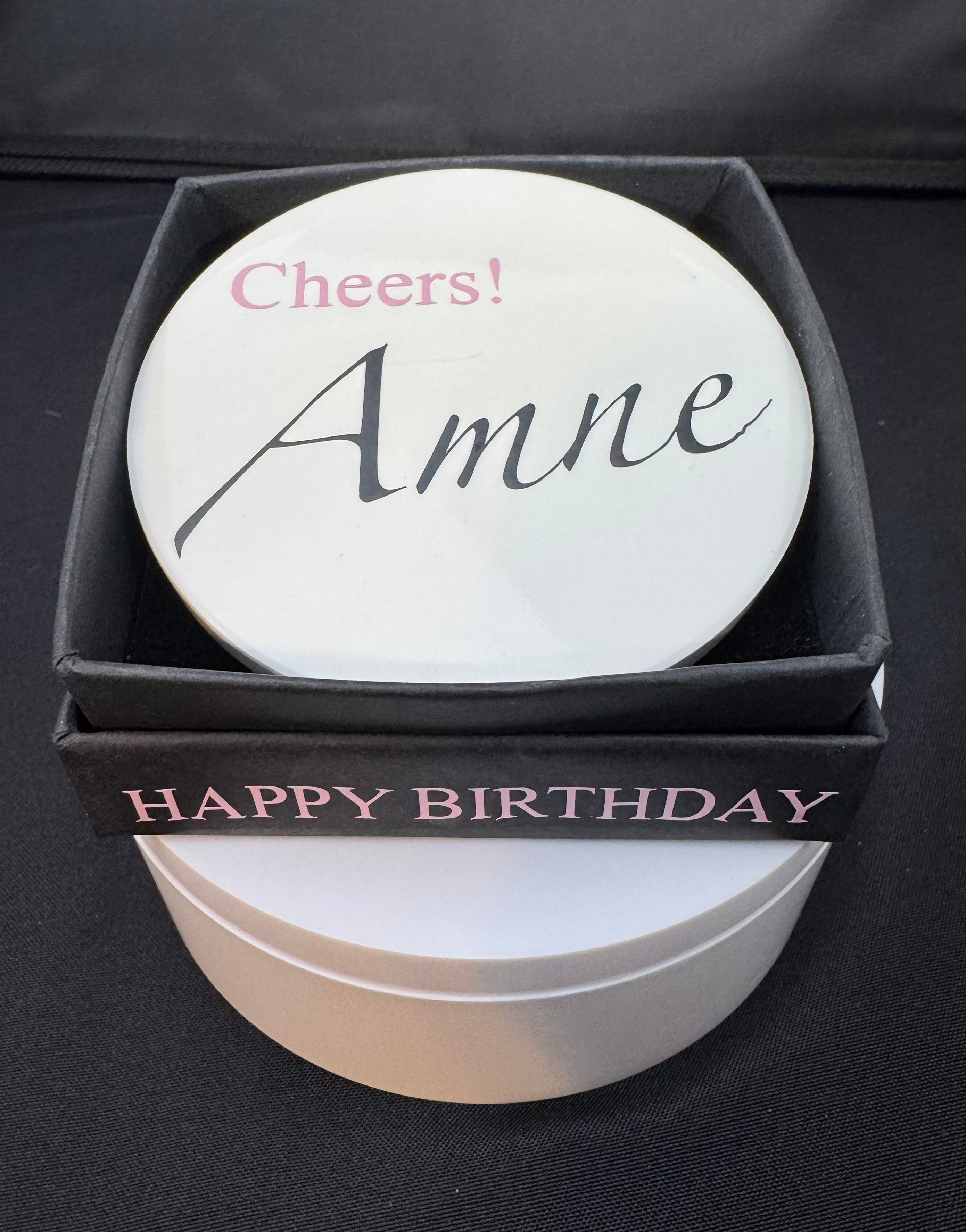 The Signature Luxe Bottle Bubble. This elegant gift turns  your bottles of choice into a stunning floating centerpieces. Ribbons of various colors gather at the top in a delicate bow, adding a graceful touch.